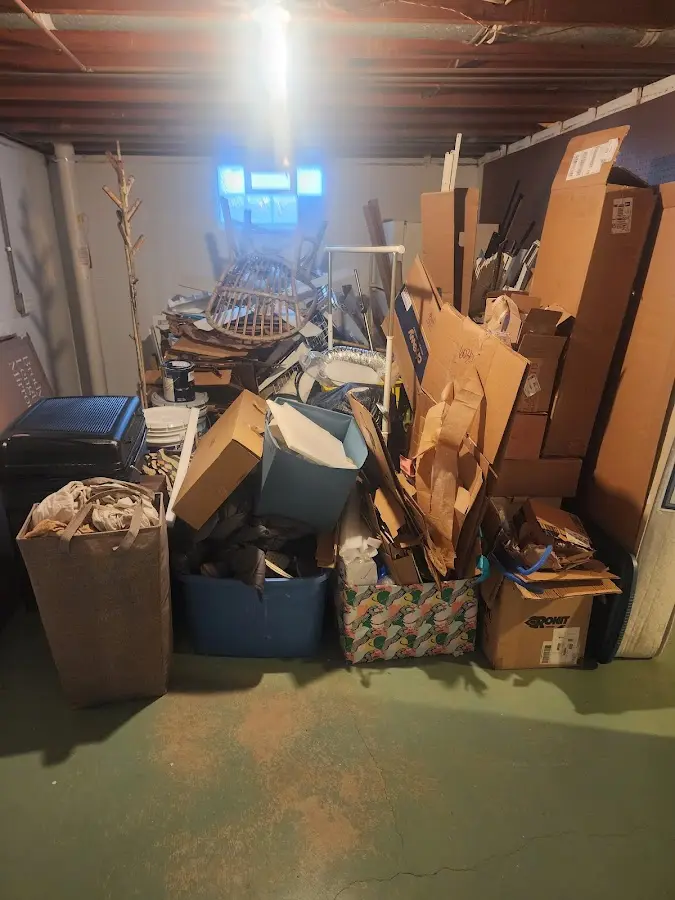 Roll-off dumpster container at job site for 2 Yard Dumpster Rental in Hudson